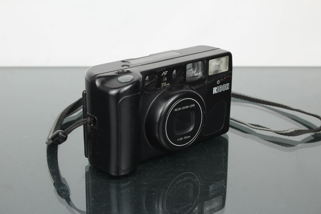 Ricoh Shotmaster Zoom 70 - Dutch|Thrift